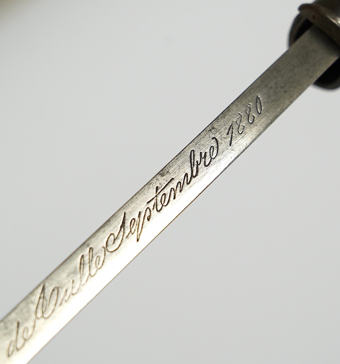 An 1880 French bayonet and scabbard for a Gras rifle. Condition - good, some pitting